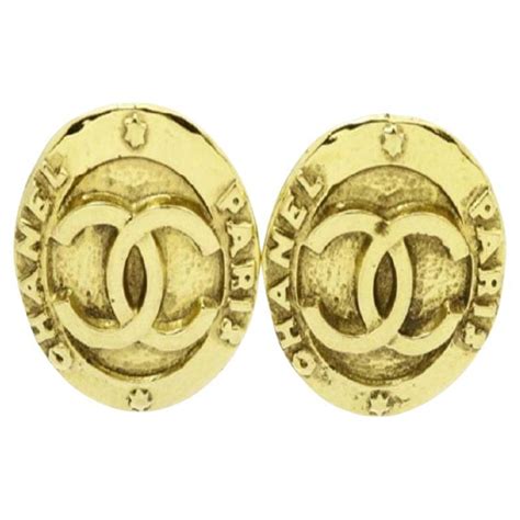 chanel earrings plastic round